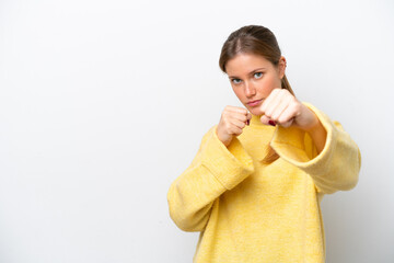 Young caucasian woman isolated on white background with fighting gesture