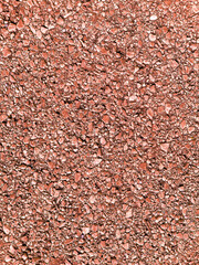 closeup garden path rock pebble gravel groundcover walkway red rocks stone landscaping