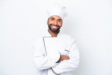 Young Brazilian chef man isolated on white background keeping the arms crossed in frontal position