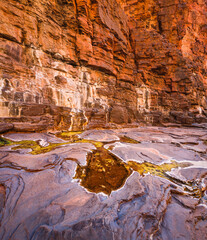 Small pools of water in the narrow slot canyon of Knox Gorge in Karijini National Park, Western Australia