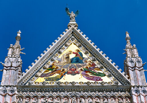 Tympanum on the main façade of Sienna Cathedral, Tuscany, Italy