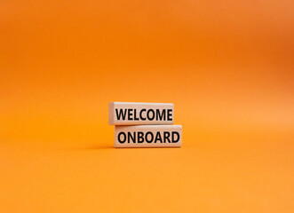 Welcome onboard symbol. Concept words Welcome onboard on wooden blocks. Beautiful orange background. Business and Welcome onboard concept. Copy space.