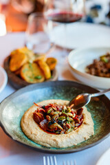 Authentic turkish hummus topped with seeds