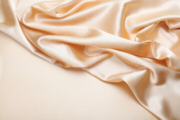Beige pearl wave fabric silk. Abstract texture horizontal copy space background.