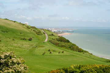 A footpath towards Eastbourne along the see above white cliffs on a long weekend in May, Sussex, England, United Kingdom