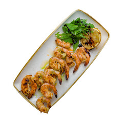 tiger shrimp kebab on plate isolated on white background top view