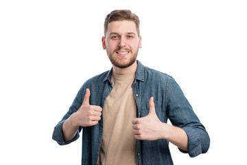 Good looking young guy showing thumbs up with friendly optimistic grin. Smiling man doing positive...