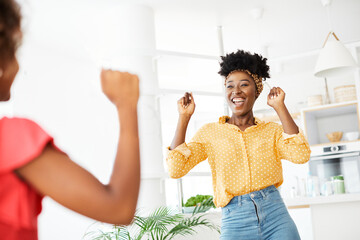 child daughter mother family happy playing kid childhood dancing parent home woman girl bonding fun cheerful