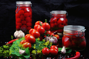 Pickled cherry tomatoes with garlic, dill, and spices. Homemade food. Rustic.