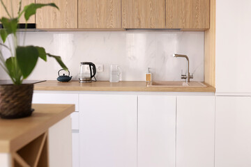 Scandinavian style cozy modern white kitchen interior with a dining zone, white modern interior in farmhouse style. nordic kitchen in loft apartment. 3D rendering. High quality photo