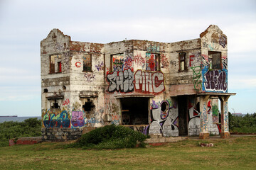 Abandoned nightclub by the sea in Ballito bay, Kwa-Zulu-natal. Painted by an artist - graffiti art.