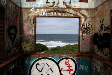 Abandoned nightclub by the sea in Ballito bay, Kwa-Zulu-natal. Painted by an artist - graffiti art.