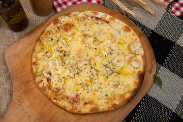 Brazilian pizza with mushroom, cheese and oregano