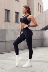Beautiful fitness woman outdoors. Athletic girl in leggings
