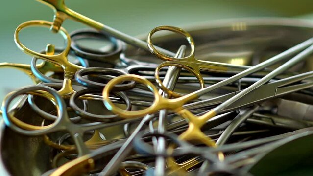 On the table are a set of disinfected metal surgical instruments. Close-up
