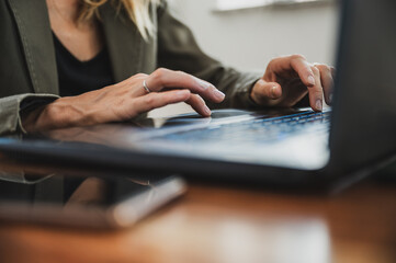 Woman typing on laptop computer