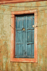 Old wooden window. Closed window. Blue

