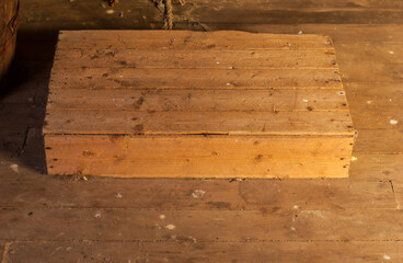 empty wooden box on a wooden floor.
