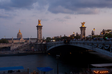 Pont Alexandre III Bridge at sunset with view of the Invalides. Paris, France