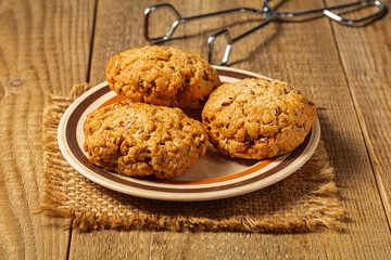 oatmeal cookies and glass of milk on woden table.