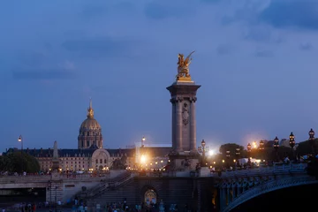 Photo sur Plexiglas Pont Alexandre III Pont Alexandre III Bridge and illuminated lamp posts at sunset with view of the Invalides. 7th Arrondissement, Paris, France