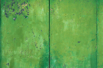 Fototapeta na wymiar matière de vieille peinture verte sur une porte de garage