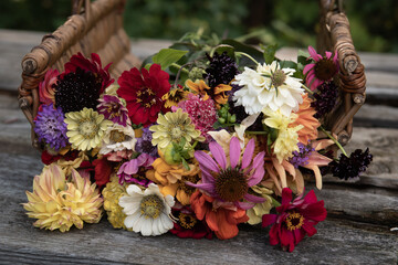 fresh cut bouquet of colorful flowers in a basket