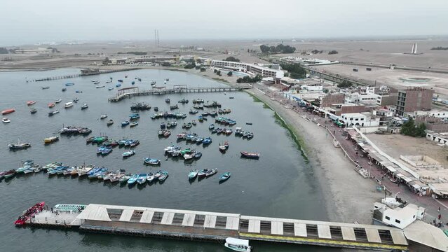 Paracas Port in Peru with the boats and city.