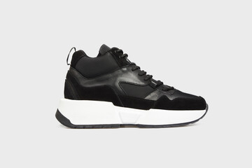 Black classic high soled women's sneaker for female isolated on white background. Footwear, Sport shoes, running shoes, front view. Template, mock up