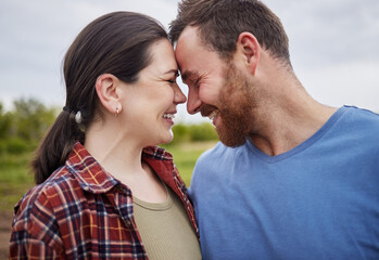 Happy mature couple bonding, laughing and having a romantic, intimate moment outdoors together. Smiling husband and wife showing affection, embracing. Soulmate feeling free, loving their relationship