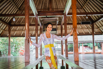 pretty balinese young woman pose to camera and smile