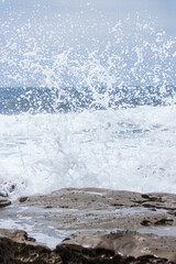 Waves crashing on rocks