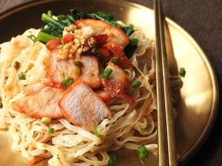 Chinese roasted pork with flat egg noodles