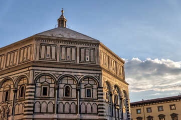 Fototapeta na wymiar Florence, Italy - July 12, 2022: Architectural details of the Cathedral of Santa Maria del Fiore, Giotto's Tower and St. John's Bapistry in Florence