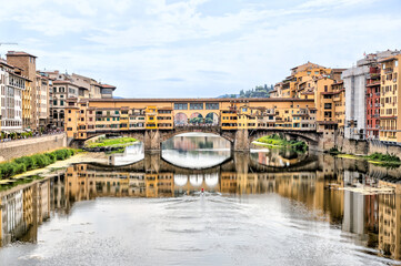 Views of the St Trinity Bridge and Ponte Vecchio along the Arno River in Florence Italy