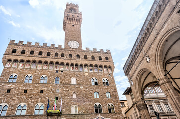 Florence, Italy - July 12, 2022: Palazzo Vecchio and the fountain of Neptune in Piazza della...