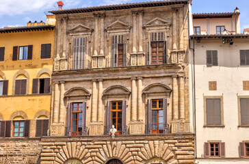 Fototapeta na wymiar Florence, Italy - July 12, 2022: Palazzo Vecchio and the fountain of Neptune in Piazza della Signoria in Florence, Italy 
