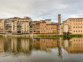 Fototapeta na wymiar Views of the St Trinity Bridge and Ponte Vecchio along the Arno River in Florence Italy