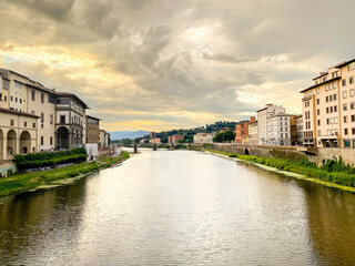 Views of the St Trinity Bridge and Ponte Vecchio along the Arno River in Florence Italy
