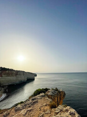 Fototapeta premium Cliffs along the coast in the Algarve Portugal. Sunrise.