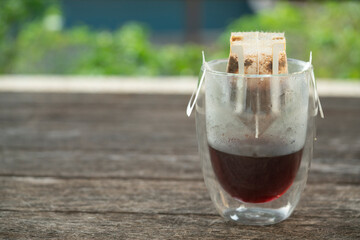 Instant freshly brewed cup of coffee on the table,Drip bag fresh coffee