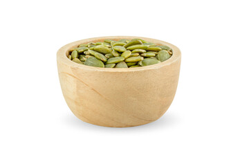 pumpkin seeds in wooden bowl isolated on white background.