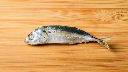 small mackerel mackerel fish on plank top background