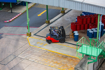 Oil barrels forklift truck move for on the transportation. © chitsanupong