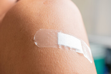 Medical adhesive plaster to stick wound on shoulder, arm, wound healing guidelines.