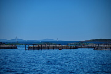 Fototapeta na wymiar Cages of fish farm in Adriatic sea