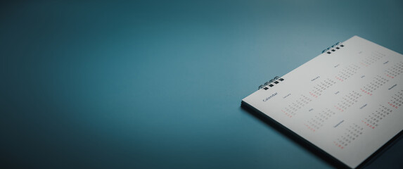 Embroidered red pins on a calendar event Planner calendar,clock to set timetable organize schedule,planning for business meeting or travel planning concept.