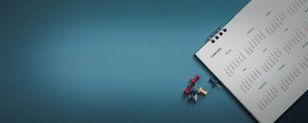 Naklejka premium Embroidered red pins on a calendar event Planner calendar,clock to set timetable organize schedule,planning for business meeting or travel planning concept.