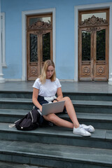 Back to school. back to college,Girl student near college,university with laptop.Education in college,Meeting students.Beginning of school year at university National Day of Knowledge