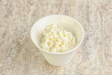 Grained cottage cheese in the bowl